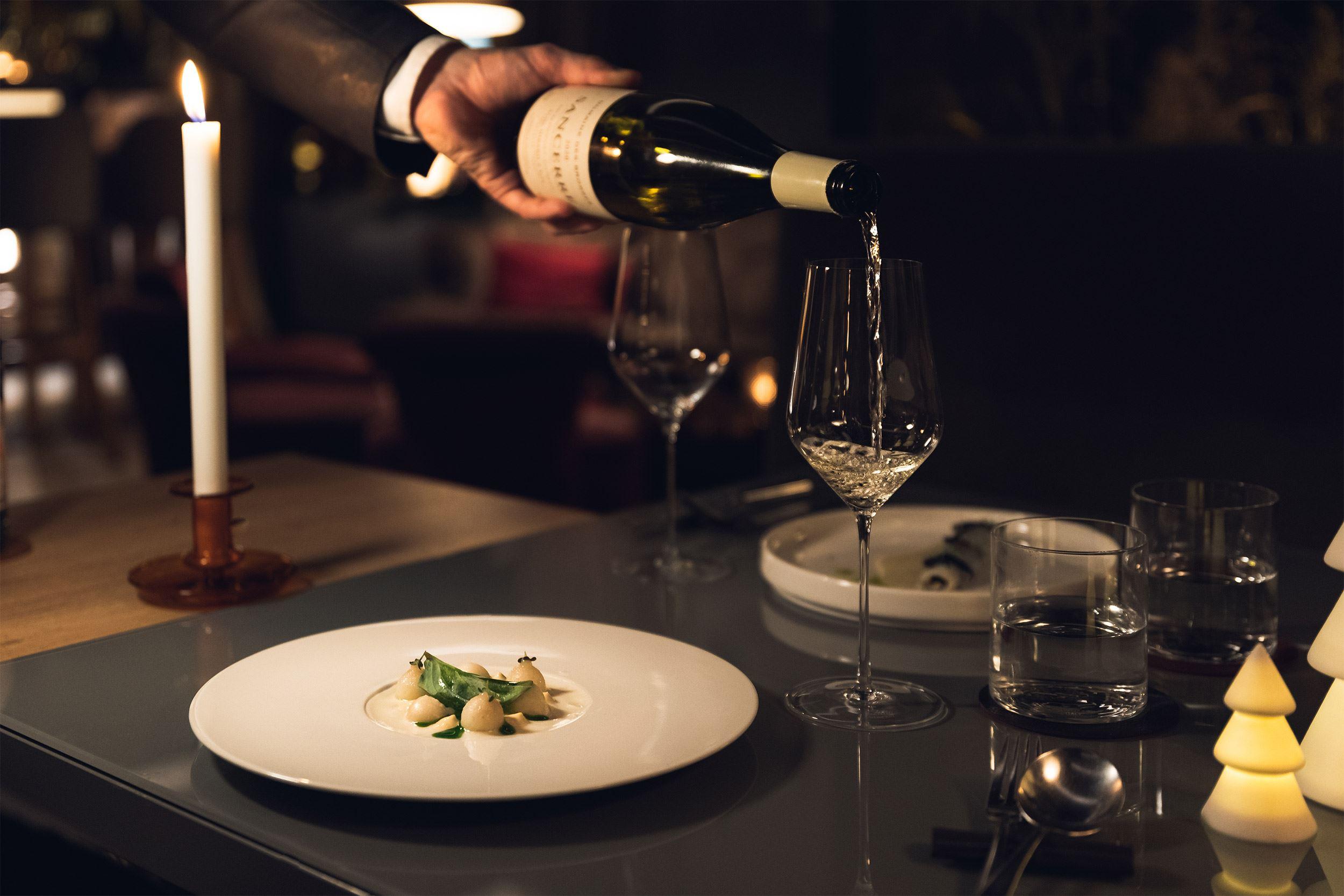 Wine being presented at the table.
